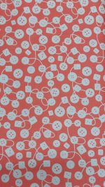 Tela botones blancos en fondo naranja